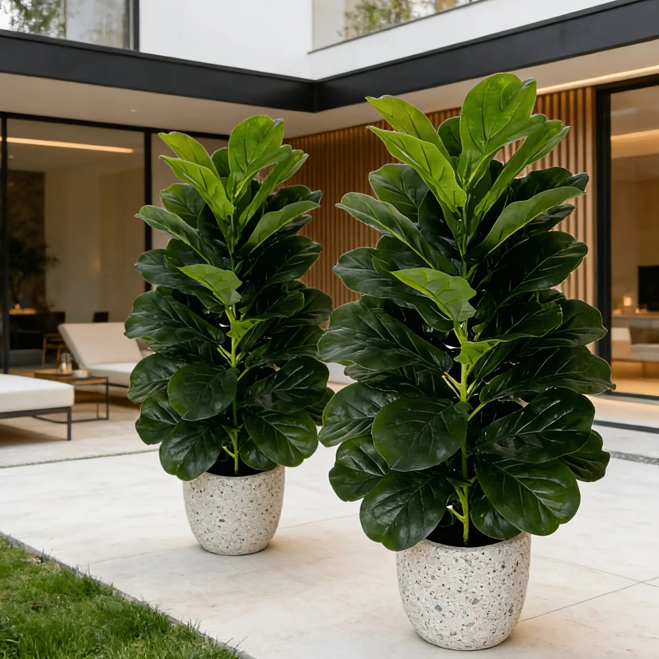 You can elevate any space with two 3-foot artificial fiddle leaf fig trees in white geometric pots.