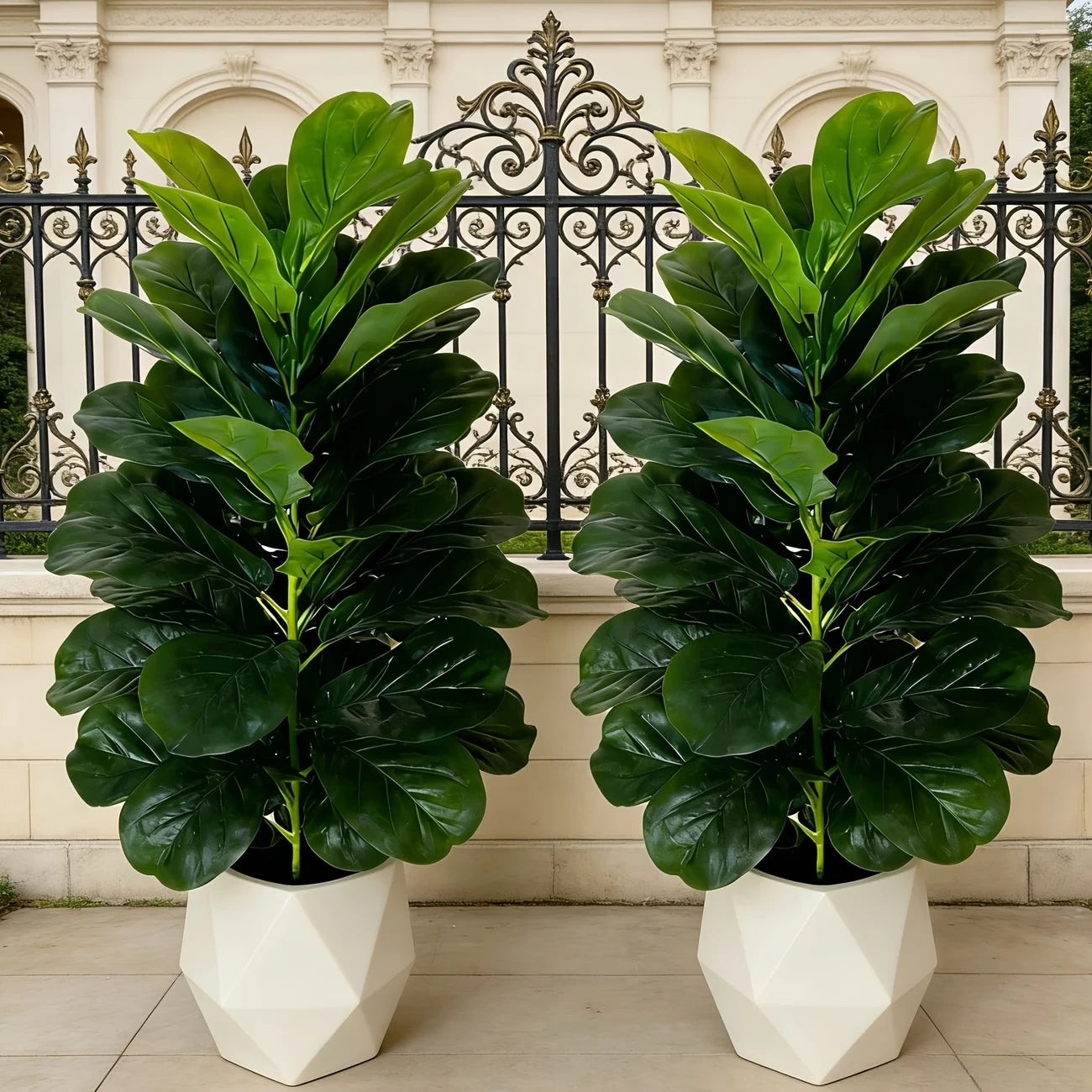 You can elevate any space with two 3-foot artificial fiddle leaf fig trees in white geometric pots.