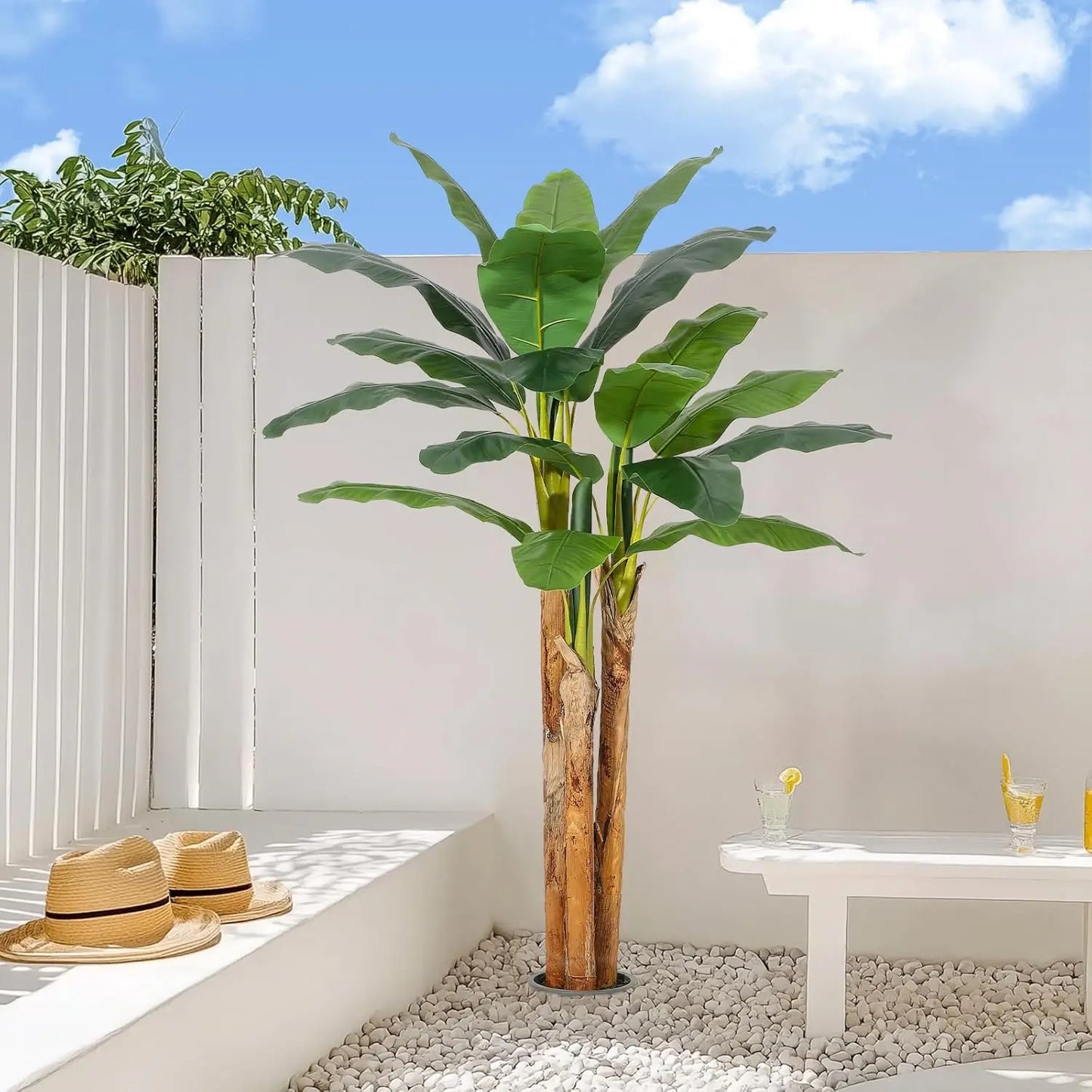 Bring tropical charm into any room with this lifelike artificial banana tree in a grey planter, designed to stay vibrant and easy to care for year after year.
