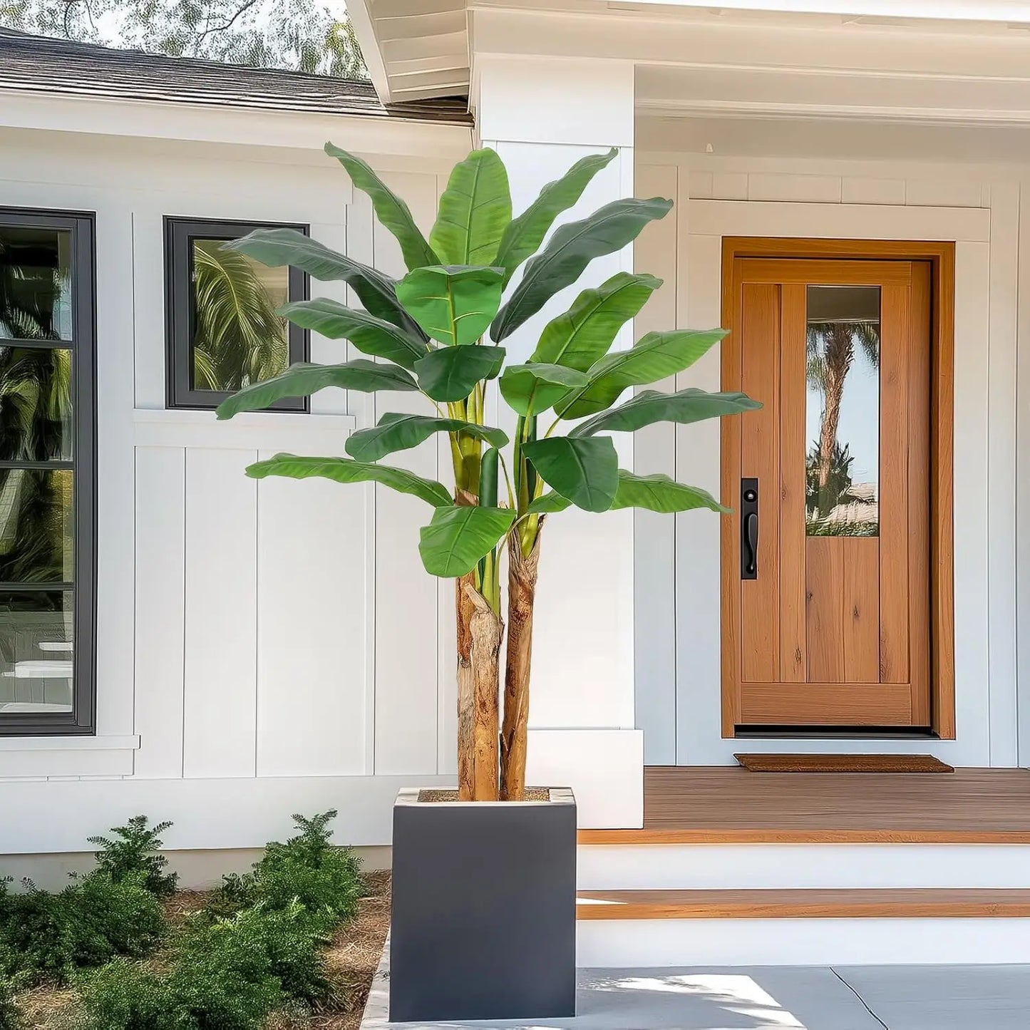 Bring tropical charm into any room with this lifelike artificial banana tree in a grey planter, designed to stay vibrant and easy to care for year after year.